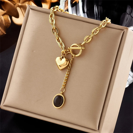Fashion jewelry Stainless steel necklace Heart pendant Black stone Trendy accessories Statement necklace Fashion trend Jewelry for women Modern design Edgy style